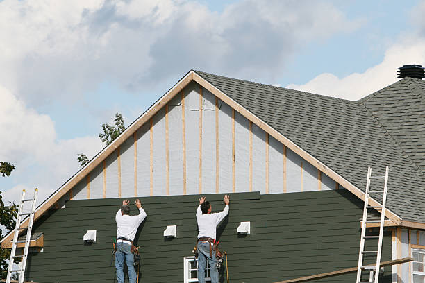 Professional Siding Contractor technician working in Evans, CO